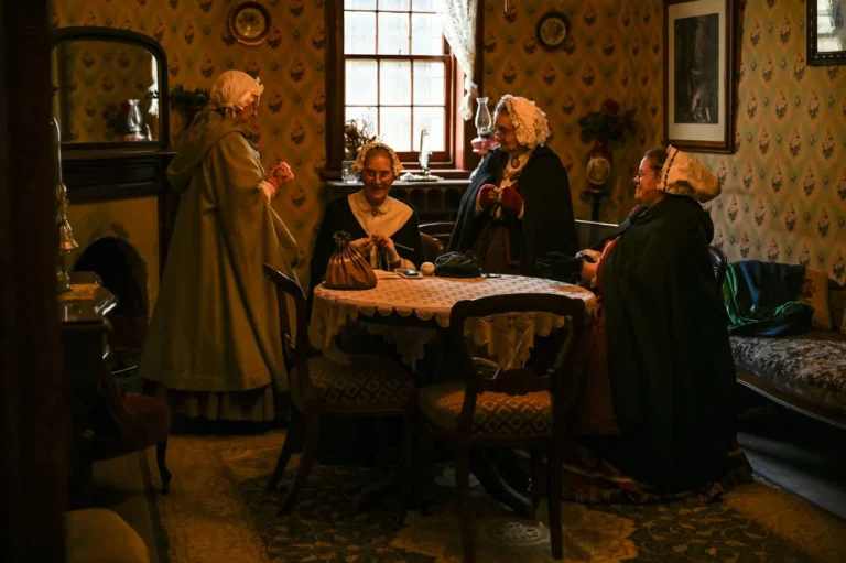 A 19th-century American parlor interior in warm lamplight
