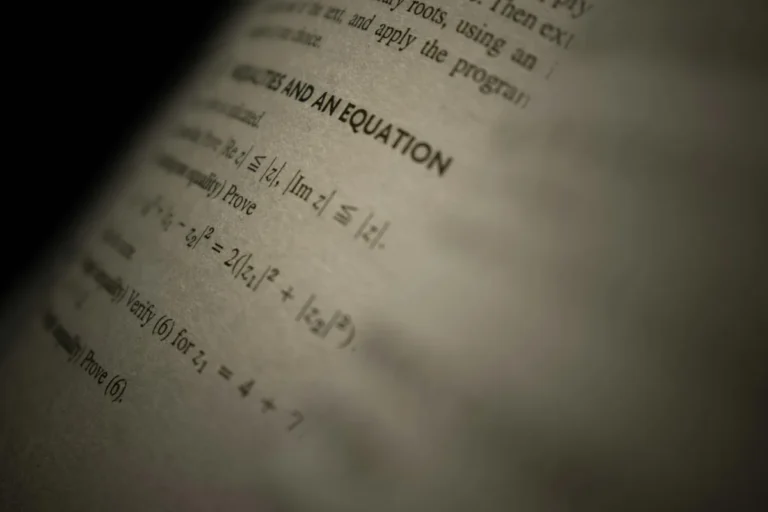 A worn library book of mathematical notation, open on a desk